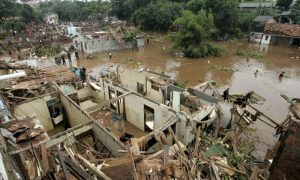 Indonesian People inspect Damage from Floods