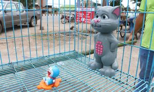 Thais pray for rain with the help of a cartoon cat